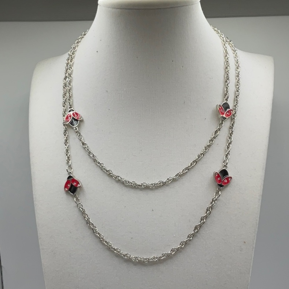 Crimzonrose ladybug necklace, layered.